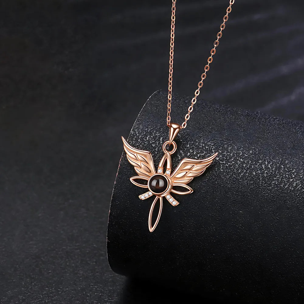 Rose gold necklace with a unique pendant on a dark background